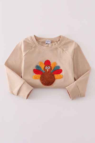 Beige turkey french knot top