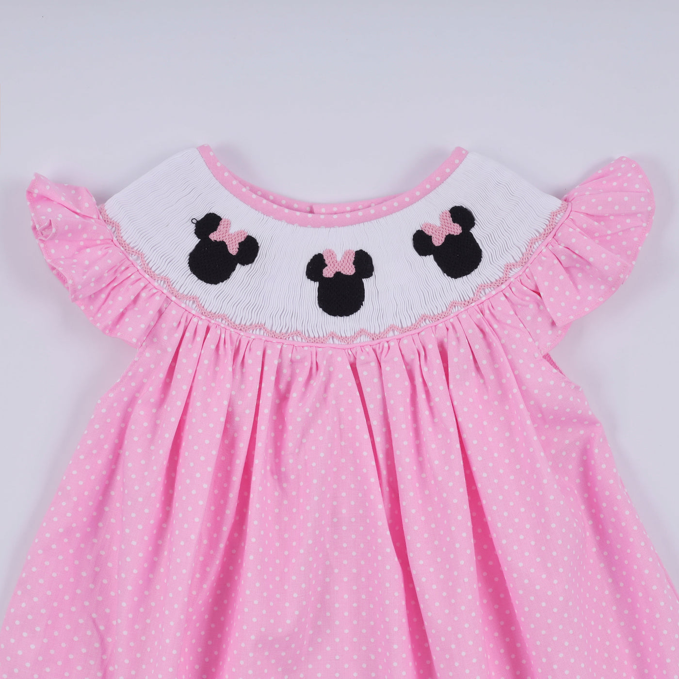 Pink character hand smocked dot ruffle dress