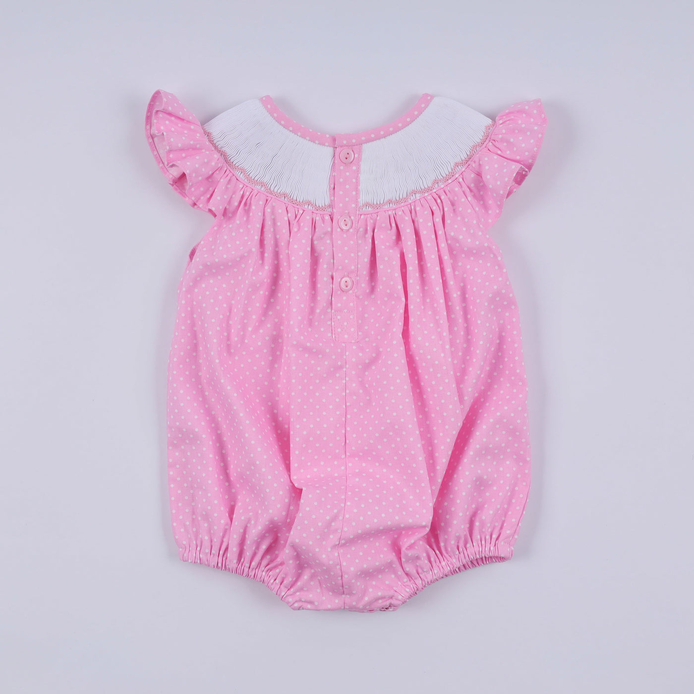 Pink character hand smocked dot ruffle bubble
