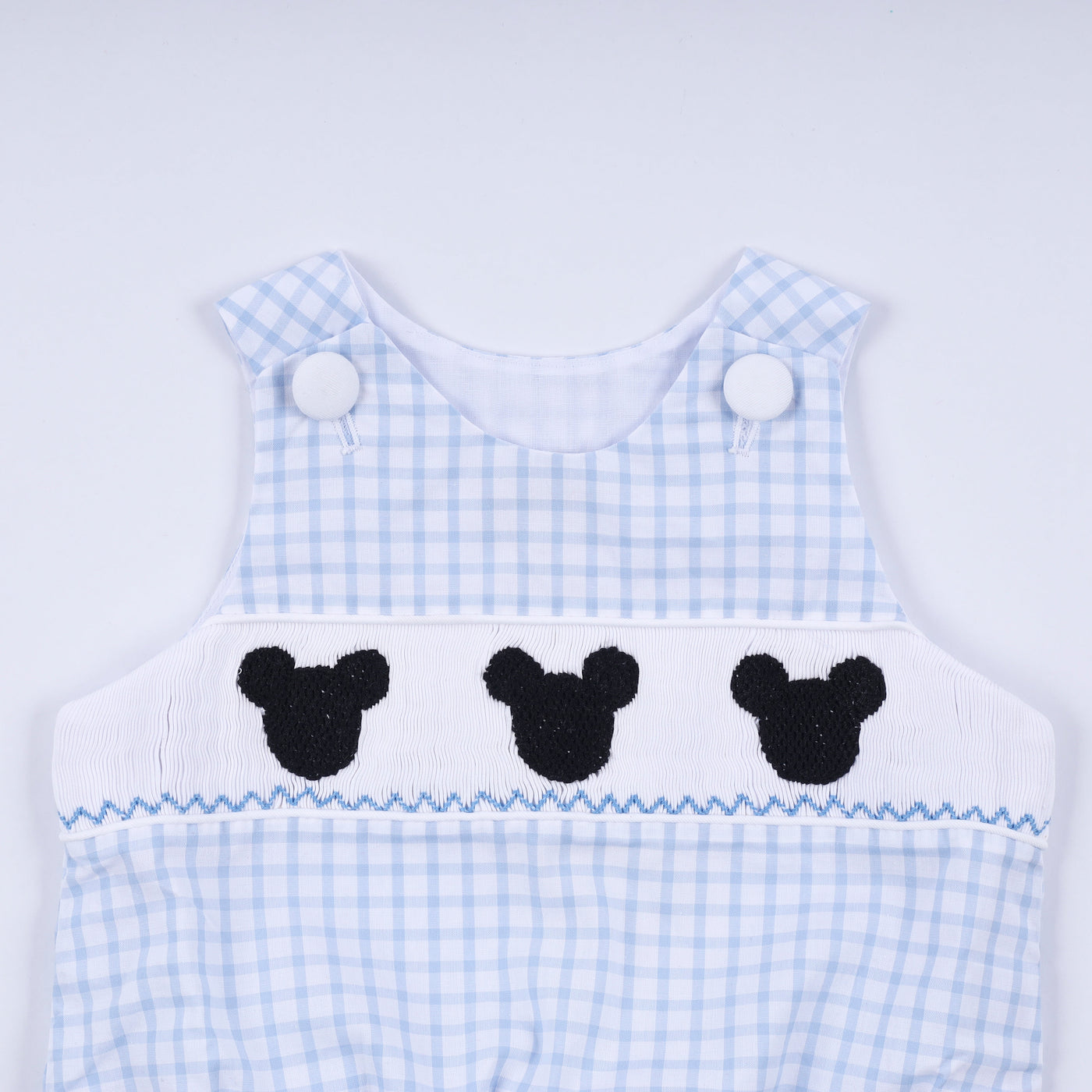 Blue character hand smocked gingham bubble