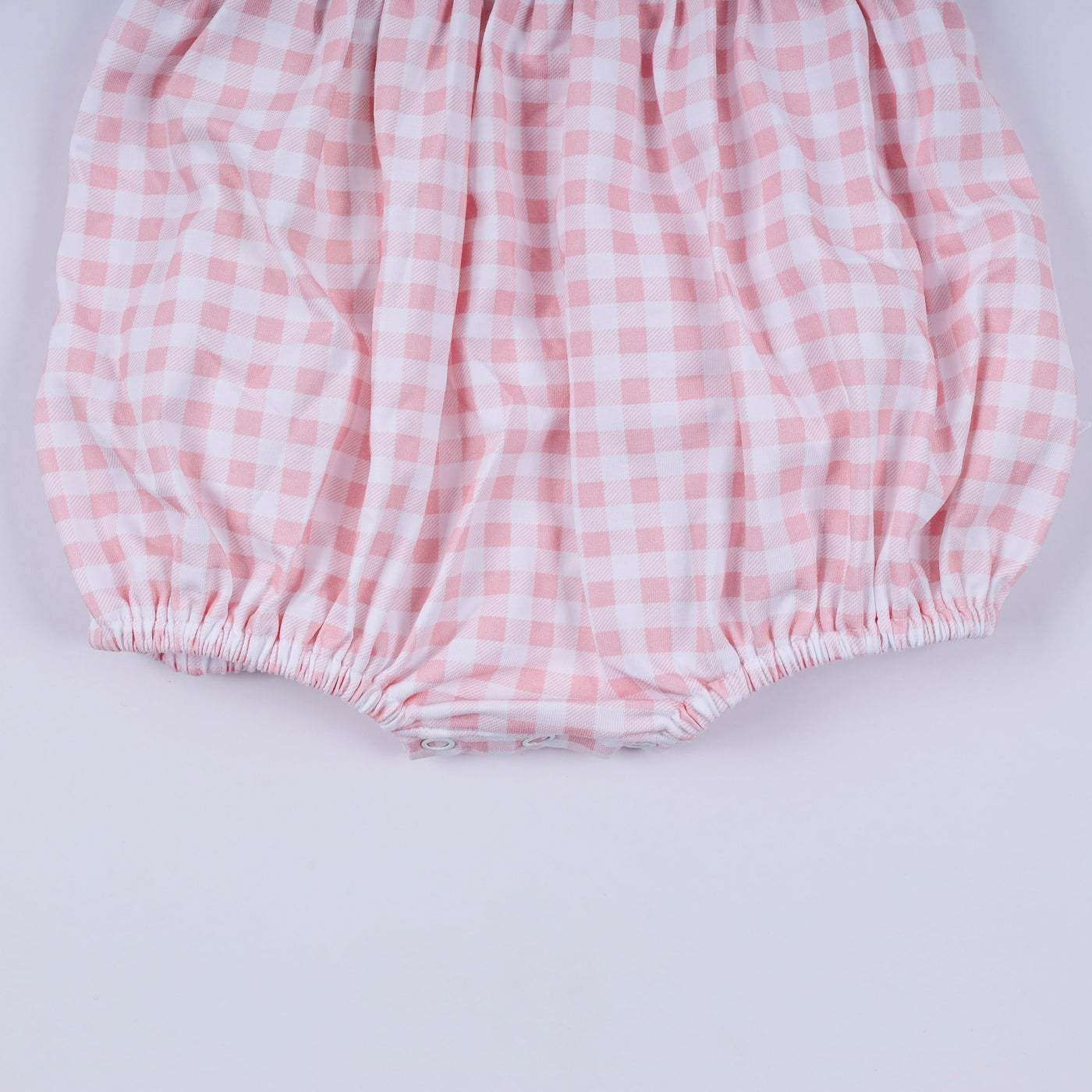 Pink character hand smocked gingham ruffle bubble